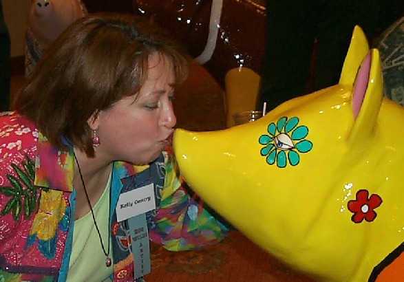 Kelly Kisses the Pig